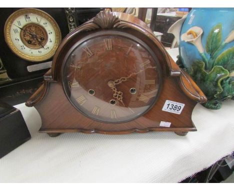 A mahogany mantel clock,