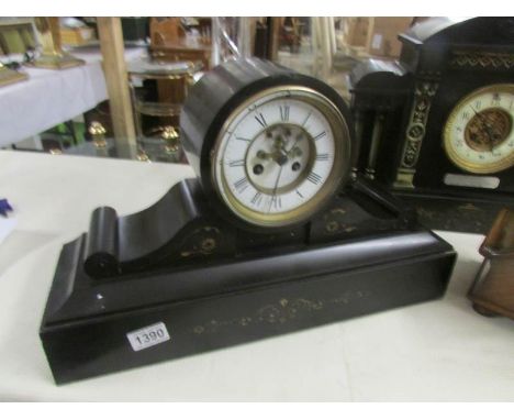 A black slate mantel clock, both springs ok but wound to limit, (no key).