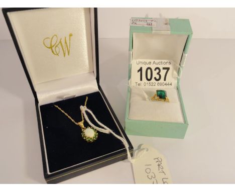 A gold ring marked 9ct with green stone and a 9ct gold pendant on chain.