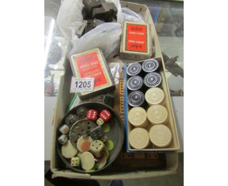 A mixed lot including cribbage board, droughts, dominoes, counters, dice, cards etc.,