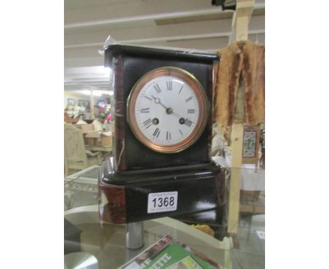 A 19th century black marble mantel clock.