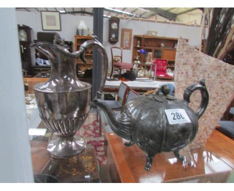 A silver plated teapot and a water jug.