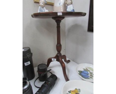 A tripod wine table.