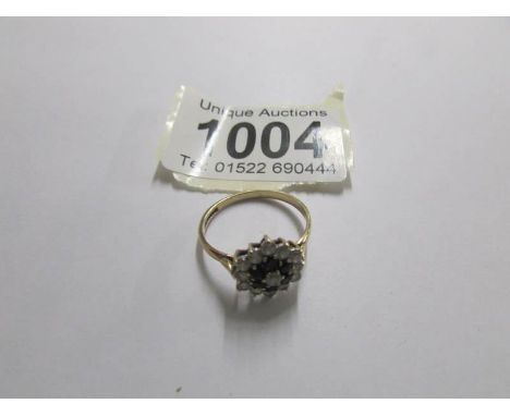 A floral pattern yellow gold sapphire dress ring. size N.