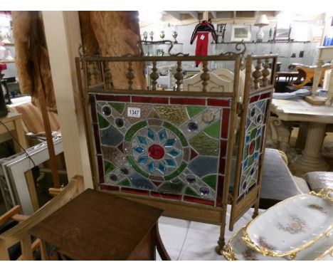 A Victorian 3 fold brass fire screen with leaded and stained glass panels. (slight damage to one or two pieces of glass).