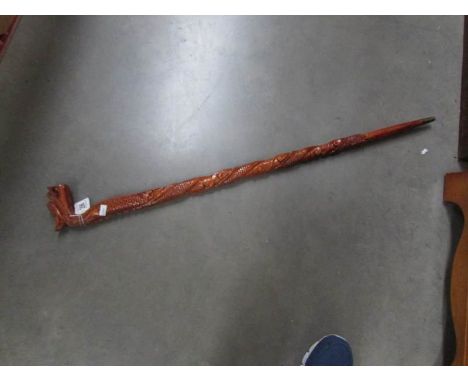 A Chinese hand carved walking stick.