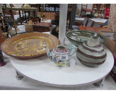 A large pottery charger commemorating the silver jubilee of Queen Elizabeth II, an 18th century teapot of European design (mi