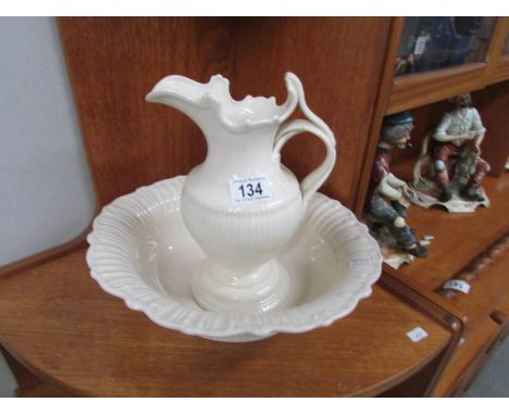 A white pottery jug and basin set.