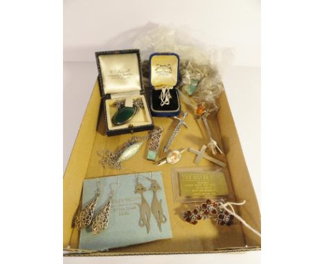 An assortment of silver jewellery including earrings, brooches, pendant on chain, ring etc.,