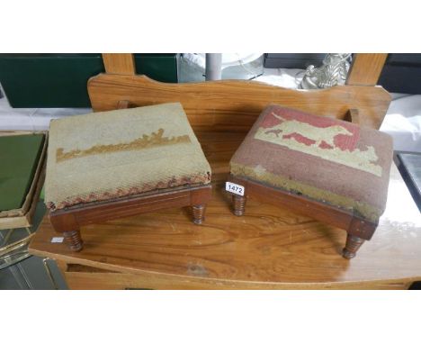 A pair of foot stools with tapestry tops.
