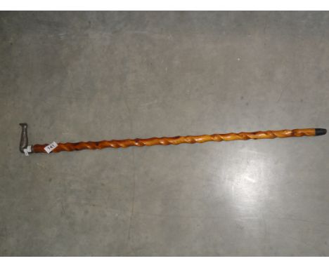 A barley twist walking stick with pewter handle in the form of a ladies leg.