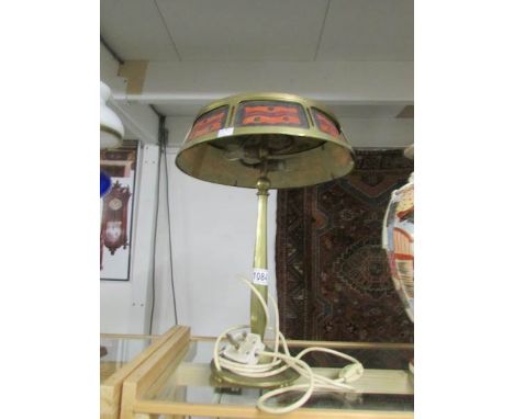 A vintage brass table lamp with shade.