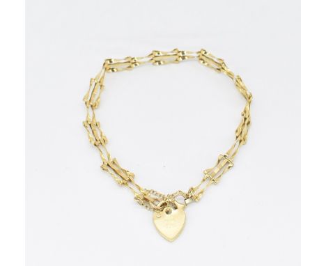 A hallmarked gold gate link chain with heart lock fastener. Hallmarked Birmingham Sponsor ASJ. Weight 2.6g. Measures approx 1