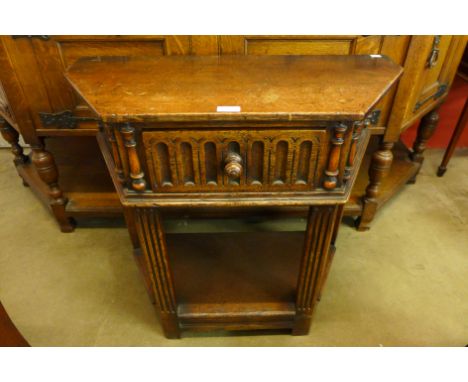 A carved oak side table