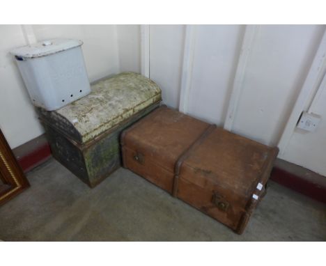 A metal dome topped trunk, enamelled bread bin and a banded steamer trunk