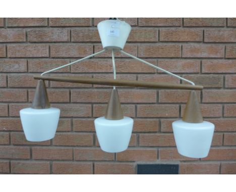A Danish teak pendant ceiling light, with white glass light shades