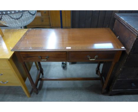A mahogany two drawer side table