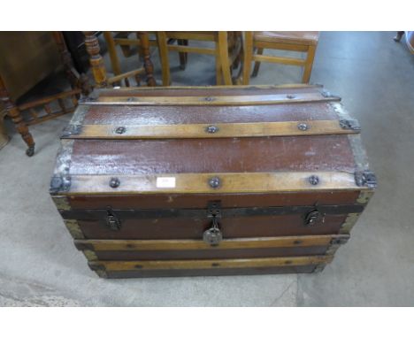 A dome topped steamer trunk
