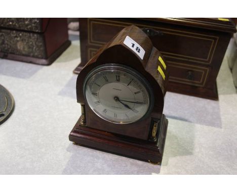A mahogany mantle clock