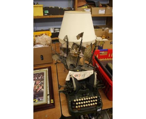 Typewriter, table lamp and model ship