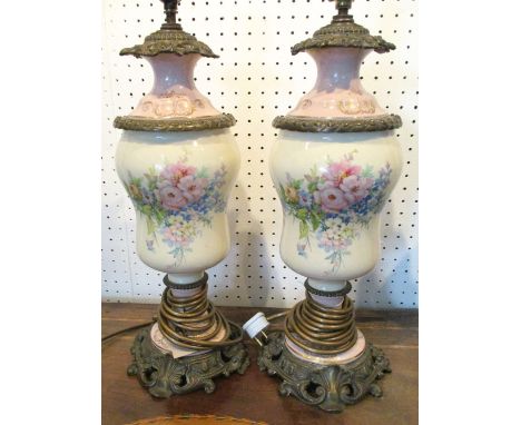 TABLE LAMPS, a pair, early 20th century continental ceramic with floral spray decoration and gilt metal mounts, 40cm H. (2)