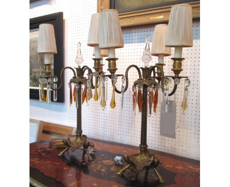 CANDELABRUM, a pair, late 19th/early 20th century gilt metal each with three lighting arms hung clear and amber glass drops, 