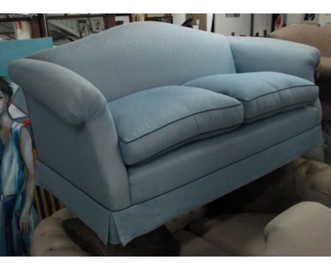 PETER DUDGEON SOFA, with a hump back and blue piped upholstery, 210cm L. (with faults)