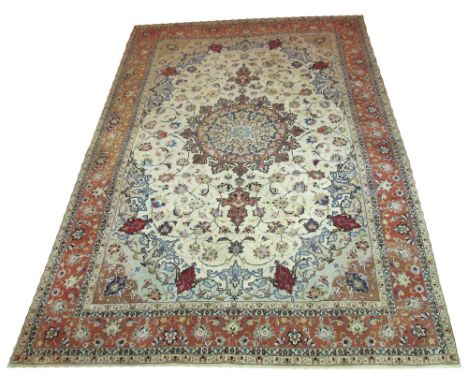 VERY FINE TABRIZ CARPET, 300cm x 200cm, central medallion on an ivory field of scrolling vines and palmettes inside a corresp