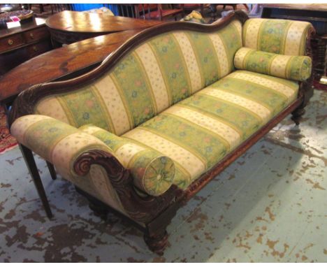 SOFA, Victorian mahogany, with foliate carved swept showframe and bold turned legs, in striped green upholstery, 226cm W x 70