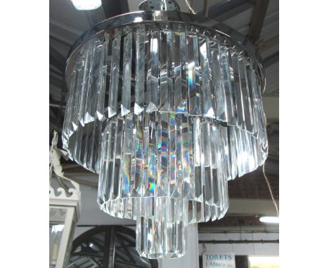 CHANDELIER, having square form long crystal drops and chrome frame with ten branches. 