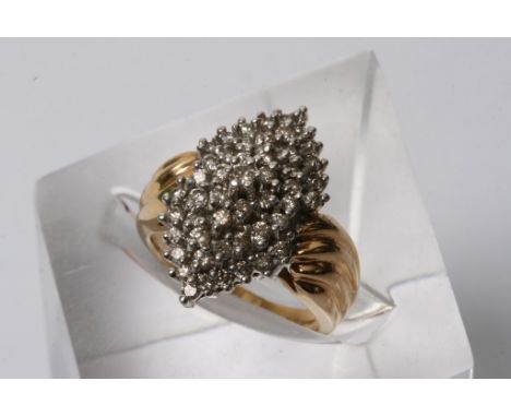 A 14ct gold and diamond cluster ring of geometric design