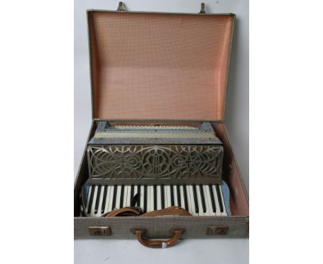 A cased Coronado Italian accordion.