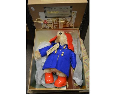 A boxed special edition Paddington bear, a boxed Steiff Teddy Clown and three small Steiff bears.