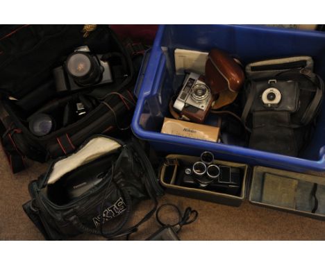 A Canon EOS 100 camera plus various other photographic equipment
