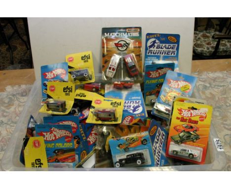 A box containing a large collection of carded model vehicles including ERTL, Mattel, Corgi, Matchbox, Efsi etc 