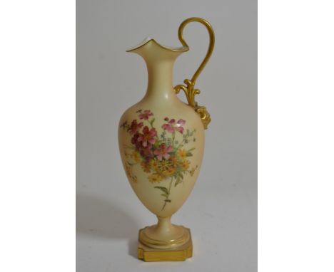 A handpainted Royal Worcester vase of inverted baluster form with loop handle and decorated with flowers on a blush ivory gro