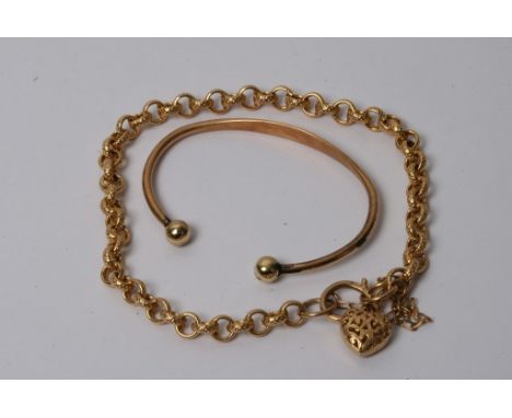 A small 9ct gold baby's bangle and a 9ct gold bracelet with padlock clasp
