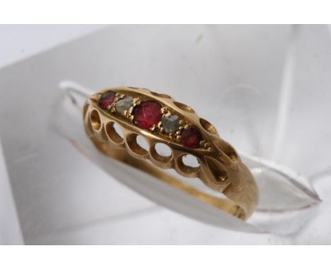 An 18ct gold ring inset with Ruby's and old cut diamonds