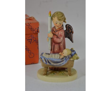 A boxed Goebel figure