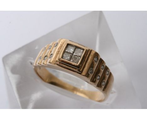 A gents 9ct gold ring inset with a total of 12 diamonds