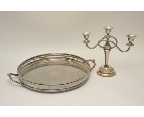 A silver plated candelabra and a silver plated galleried tray.