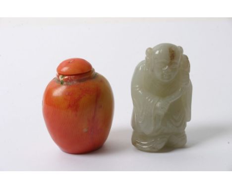 A coral scent bottle together with a carved jade figure of an Oriental elder.