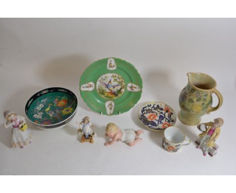 A Royal Doulton Brangwyn ware jug, a decorative cup and saucer, four ceramic figures, Japanese bowl and a transfer printed pl
