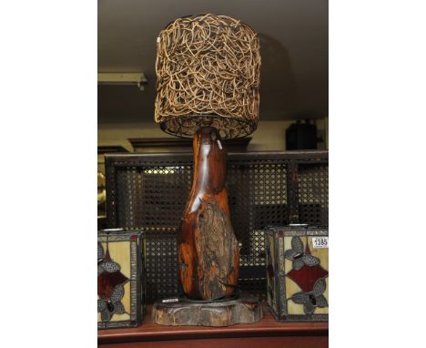 A carved hard wood naturalistic,polished wood lamp base