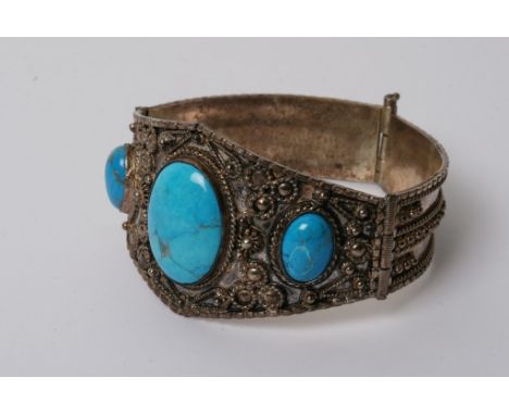 A white metal filigree type bangle 