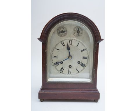 A Gustav Becker beehive shaped  mantle clock  with drop dial, key and pendulum