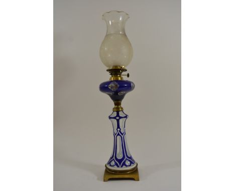 A Quality Victorian blue overlay and brass mounted oil lamp