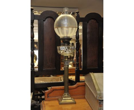 A brass oil lamp with Corinthian column base.