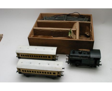 A boxed "Stronlite" electric Japanese tin plate train set comprising locomotive, two carriages in GWR Livery and a circular t