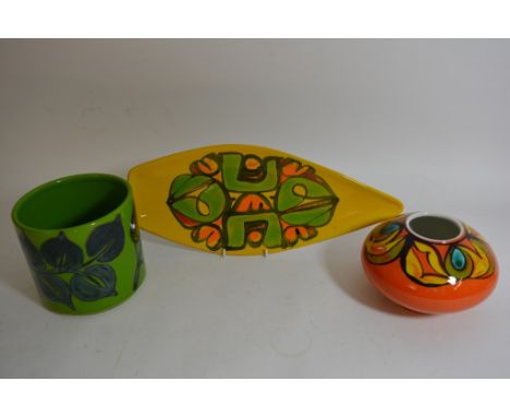 Three items of Poole pottery to include a spear shaped dish and two vases.